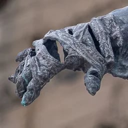 Close up on the hand of the Malenki Robot statue.