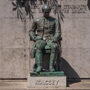Full statue of Ferenc Kölcsey with his famous inscription behind him.