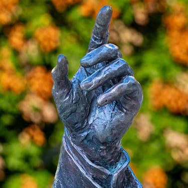 Alternate view of the pointing hand, highlighting direction and resolve in diplomacy.