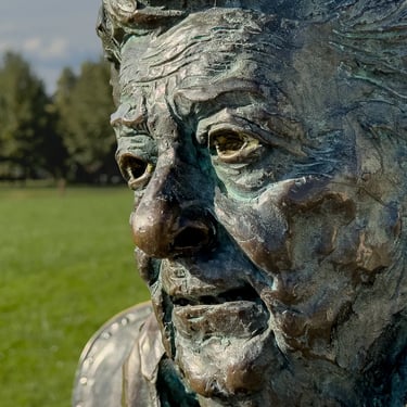 Portrait close-up of Hilda Gobbi’s face in bronze, with attentive, expressive gaze.