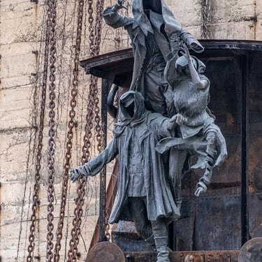Three figures frozen mid-jump toward the void, with chains and concrete behind them.