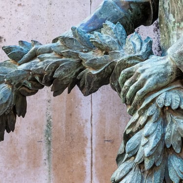 Abbot Molnár’s hand holding a wreath in statue, symbolizing tribute and remembrance linked to Zichy’s lasting influence.