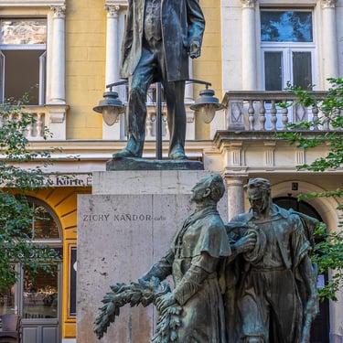 Entire statue complex of Nándor Zichy, with companions honoring the statesman and his political legacy.