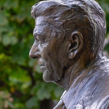 Side portrait of the Reagan statue’s head, edges lit with the face in soft shade.