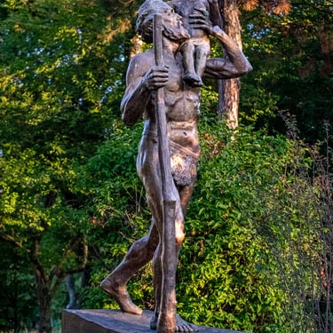 Full statue of Saint Christopher carrying Jesus, dedicated to faith and sanctuary.