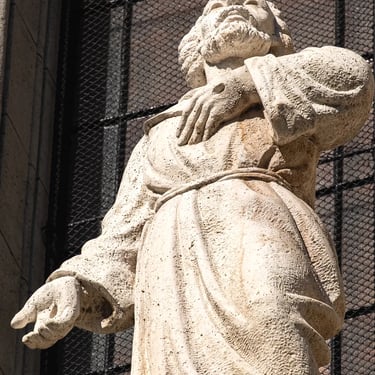 Upper body of St. Francis with head and both hands, conveying spiritual focus.