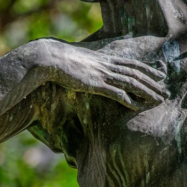 Detail of the other hand, gently closed, suggesting a soft, flowing motion.