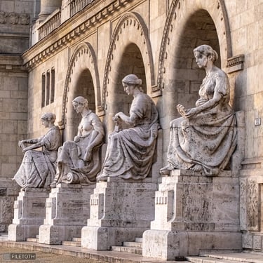 All four reconstructed statues with the main entrance of TUB, seen from opposite side.