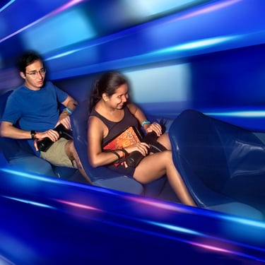 An on-ride photo of Travel Agent Andrew and his partner riding Space Mountain at Magic Kingdom.