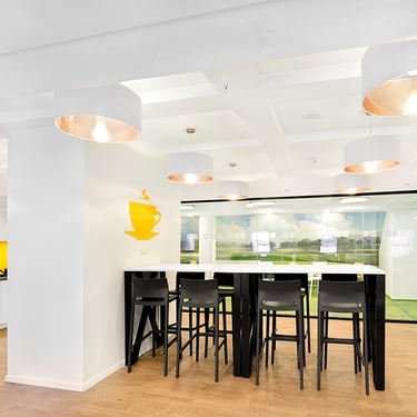 view of kitchen with high stools and tables