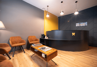 Modern reception and comfortable waiting area at DentalX Prague