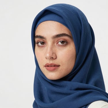 the face of a women wearing a blue hijab