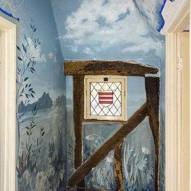 Exquisite landing with a painted mural of a serene night scene, showcasing a crescent moon, mountains, and ocean views.