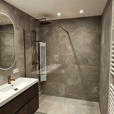 a bathroom with a shower and a large mirror