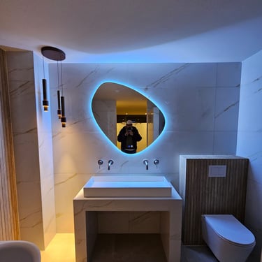 a bathroom with a mirror and a sink