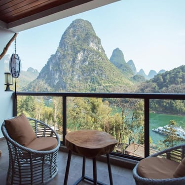 View the scenery from your private balcony at the Yangshuo Li River Resort