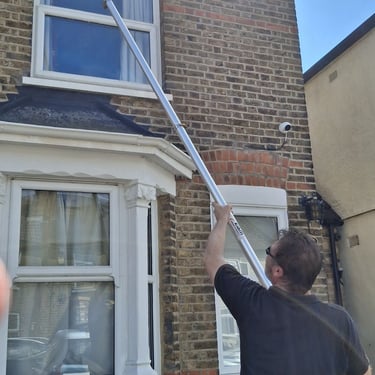 no mess vacuum gutter cleaning by MT Gutters using a 6m pole cleaning system