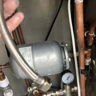 Dismantling and draining down an outside kitchen under sink water heater for the winter season