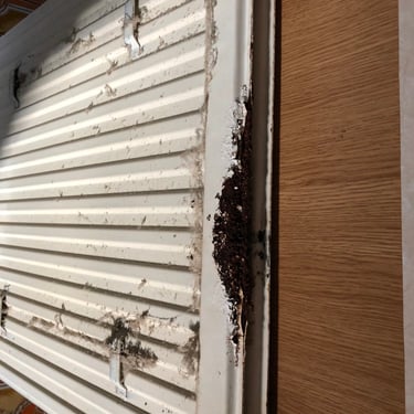 severely rusted radiator from a damp bathroom