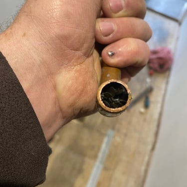 a blocked central heating pipe filled with iron oxide