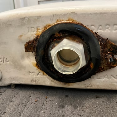 Leaking toilet cistern has caused the close couple connecter bracket to corrode and rust away making the leak worse