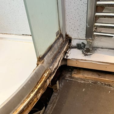 Leaking shower cubicle that has been left thus causing a severe leak into the kitchen below