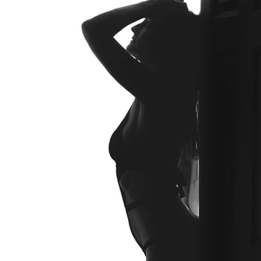 a woman in a black and white photo. boudoir photography