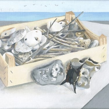 wooden box of stones and twigs