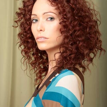 Defined curly hair with a cool radius edge. Portrait Hair Makeup and Photography by Bruce Kushnick for wonderfulportraits.com