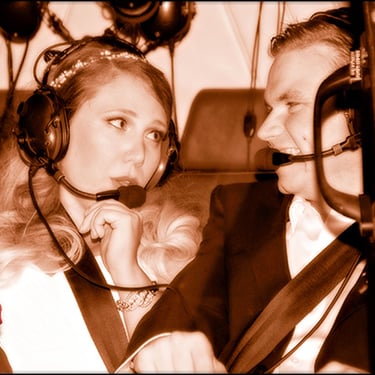a man and woman in a helicopter