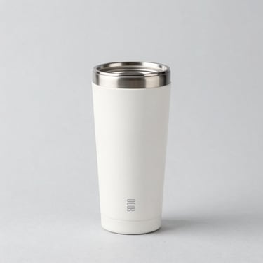 Bright high-key product photography of premium thermal cups and travel mugs with custom engraving, light gray backdrop, sharp focus