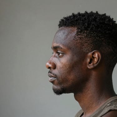 Photo of a confident businessman standing in front of a sleek digital workspace.