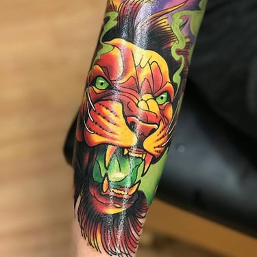 Custom bright neo traditional color lion tattoo by Jeff Wortham in Oviedo, Florida at Orange Grove 