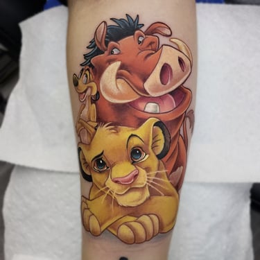 Custom bright coloful Lion King tattoo by Tone Rez at Orange Grove Tattoo in Orlando, Florida
