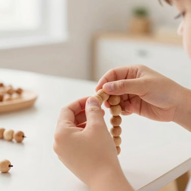 Child carefully threading wooden beads to practice fine motor skills, soft natural lighting