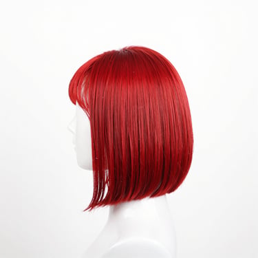 Bob cut straight human hair lace wig, sleek styling, high-key white background