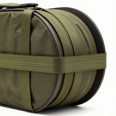 Close-up of an endless loop cargo strap wrapped tightly around industrial cargo on a white background.