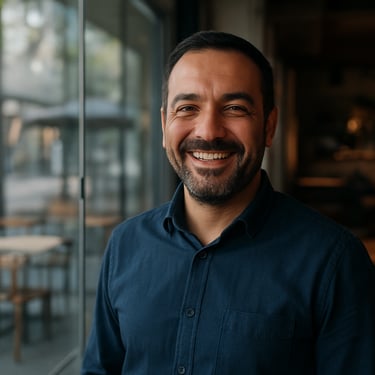 A professional Anatolian / Turkish male client smiling in front of a newly installed guillotine glass system in a modern cafe, soft morning light, professional photography.