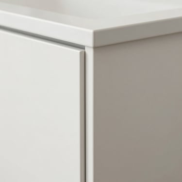 Macro detail shot of a modern slim shaker cabinet door in crisp white finish, showing the precise narrow stile construction.