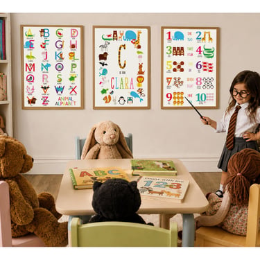 Young girl playing teacher in a cosy playroom with animal alphabet, personalised initial and number educational prints