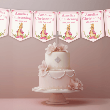Personalised pink rabbit christening bunting displayed above an elegant pink baptism cake table