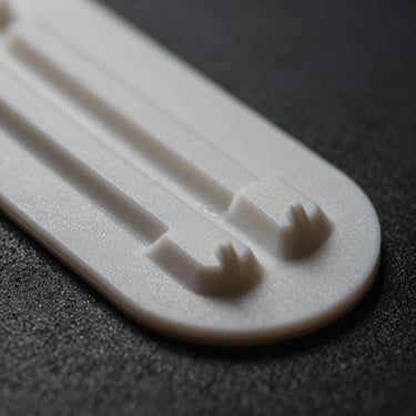 Close-up of a molded PVC patch with sharp dimensional details and matte finish, waterproof texture.