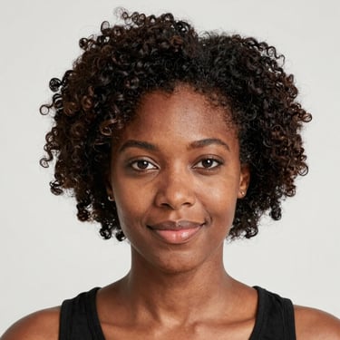 Close-up of a relaxed woman gently touching her waist, with a warm beige background.