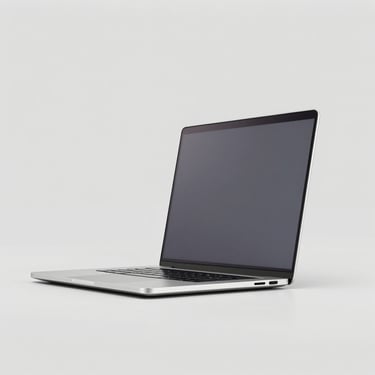 Sleek metallic laptop open, centered on a light gray background, clean studio lighting