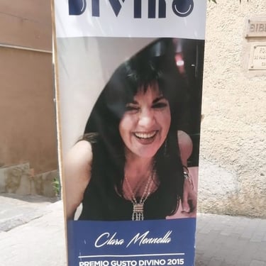 Manifesto del Premio Gusto Divino 2015 con la foto di Clara Mennella giornalista