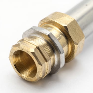 Macro shot of machined brass and steel automotive AC hose fittings, clean metallic textures, high-key studio lighting, 50mm lens