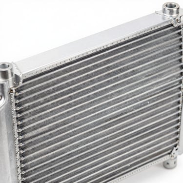 Close-up of a parallel-flow automotive AC condenser aluminum fin structure, crisp metallic details, bright studio lighting, 50mm lens