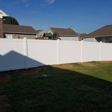 White vinyl residential privacy fence installed at a home in Central Kentucky