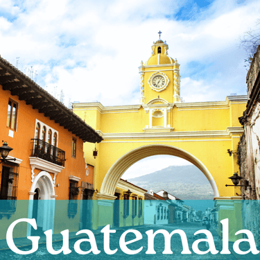 The yellow arch in Antigua with the word Guatemala written in white