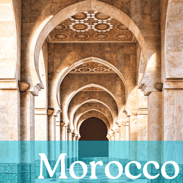 A row of columns with a brown and white tiled ceiling with the word Morocco written in white
